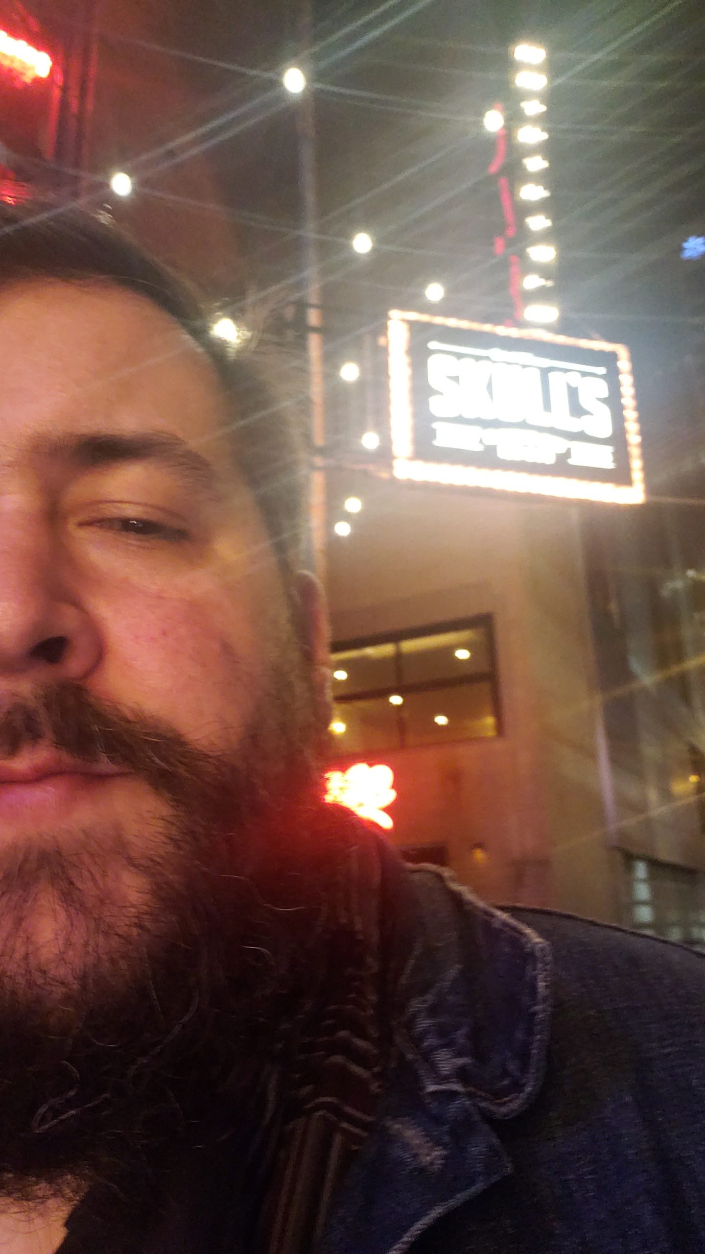 Chris Mallon is a Hospitality Advocate and Educator in Nashville representing the bartender mixing drinks at a busy bar on Broadway