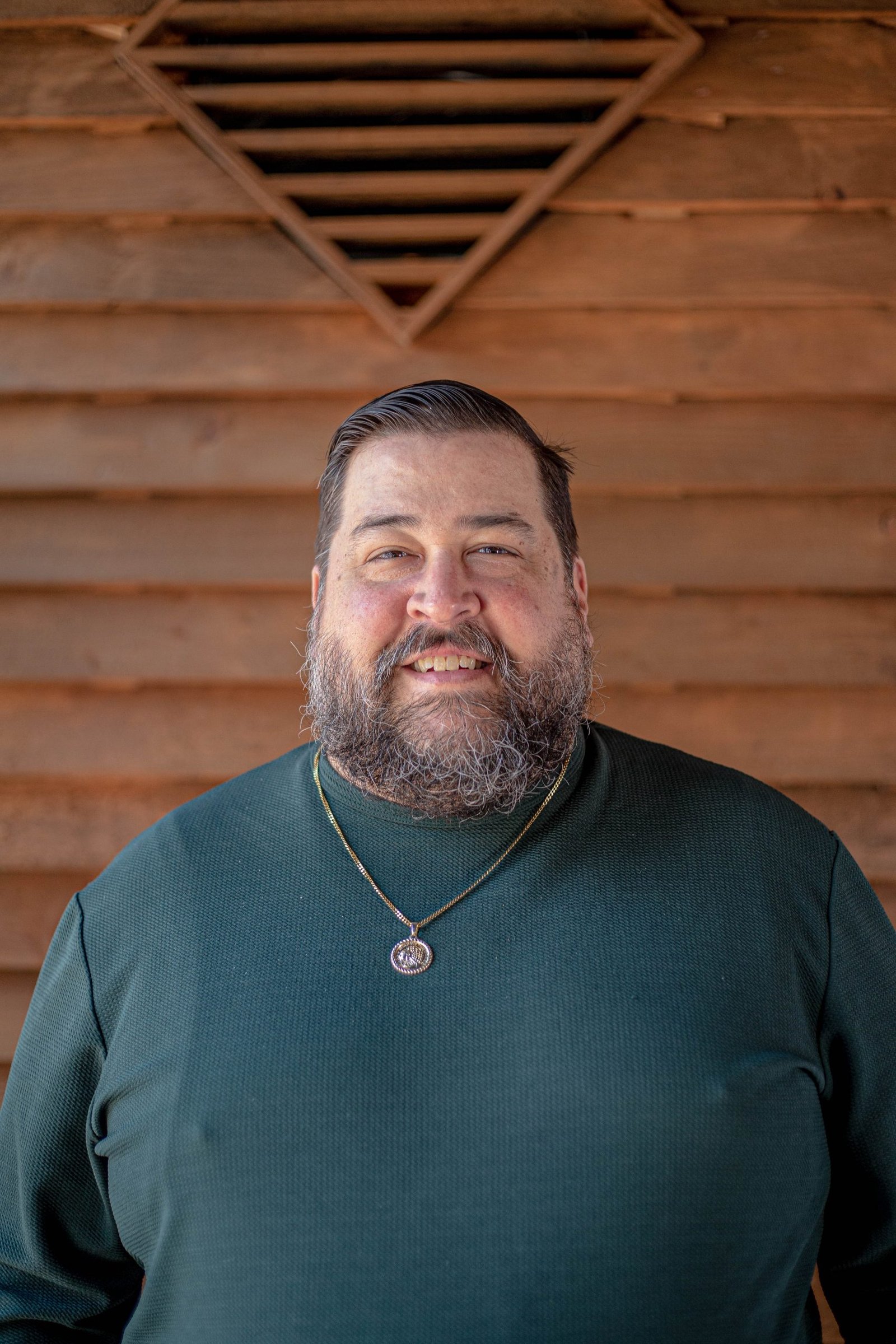 Chris Mallon, hospitality industry leader, standing in a relaxed pose, reflecting the theme of resilience and quiet leadership discussed in the blog post titled “The Overflow Is a Lie.”