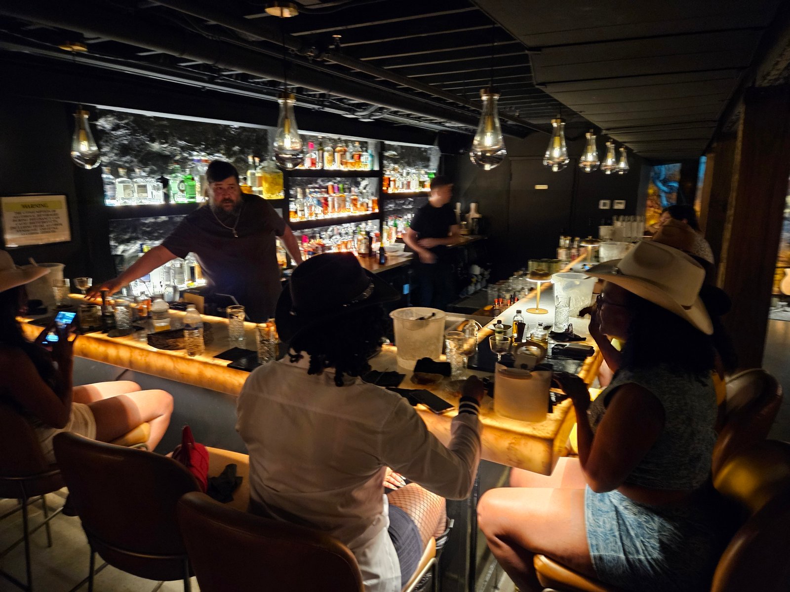 Guests building cocktails during a hands-on Nashville cocktail making class
